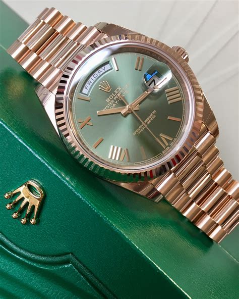 green dial gold rolex.